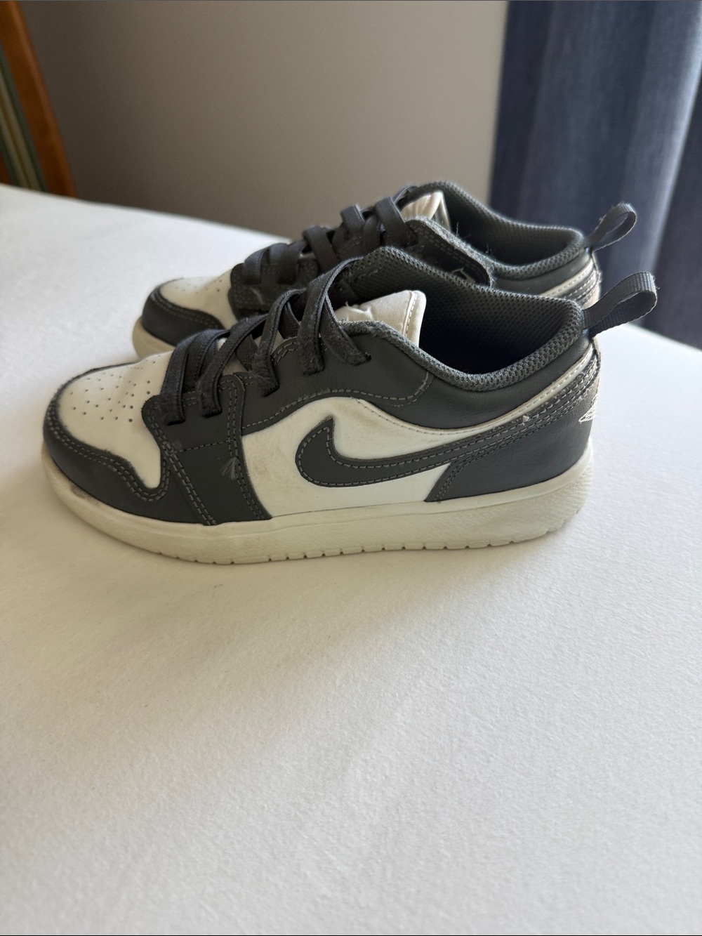 Nike Jordan 1 Kids Low-Top Sneakers in White and Dark Gray